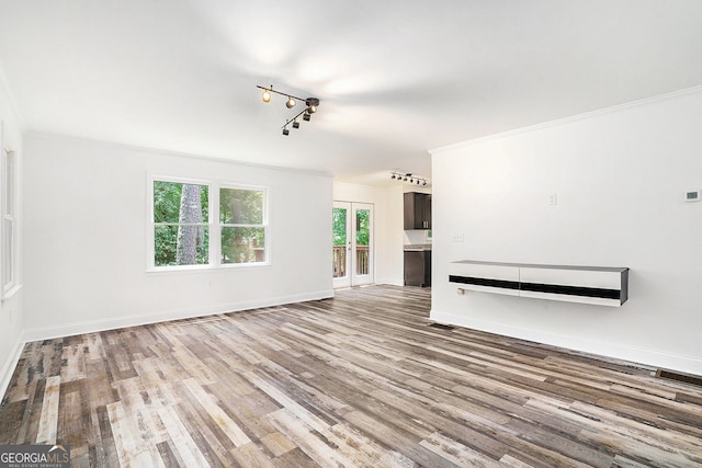 2674 Skylane Dr, Marietta, GA 30062 - unfurnished living room featuring wood finished floors and rail lighting