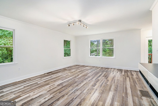 2674 Skylane Dr, Marietta, GA 30062 - unfurnished room featuring healthy amount of natural light, crown molding, and wood finished floors