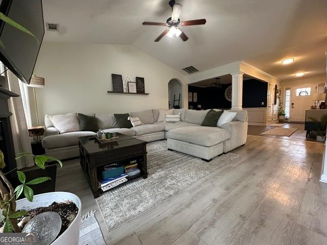 298 Timberwind Dr, Byron, GA 31008 - living area featuring arched walkways, ceiling fan, wood finished floors, and lofted ceiling