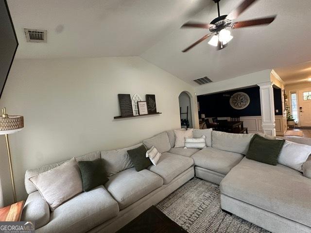 298 Timberwind Dr, Byron, GA 31008 - living area with decorative columns, vaulted ceiling, ceiling fan, and arched walkways