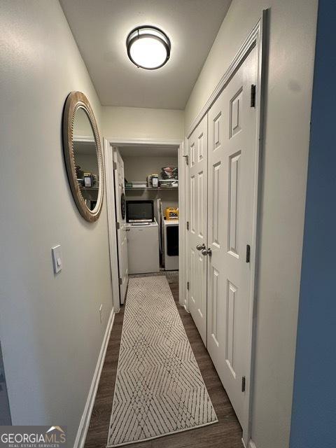 298 Timberwind Dr, Byron, GA 31008 - hall featuring washing machine and clothes dryer, dark wood-style floors, and baseboards