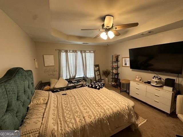 298 Timberwind Dr, Byron, GA 31008 - bedroom featuring a tray ceiling, carpet, and ceiling fan