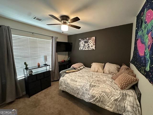 298 Timberwind Dr, Byron, GA 31008 - carpeted bedroom featuring a ceiling fan