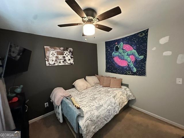 298 Timberwind Dr, Byron, GA 31008 - bedroom with carpet floors, baseboards, and a ceiling fan