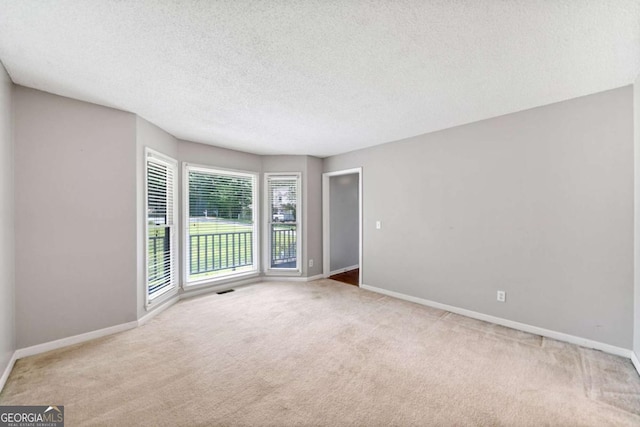 308 Golden Ct, Canton, GA 30114 - carpeted empty room featuring baseboards and a textured ceiling