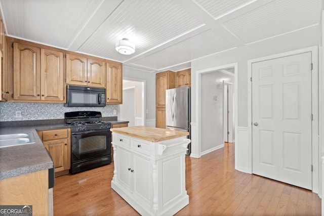 308 Golden Ct, Canton, GA 30114 - kitchen featuring black appliances, light wood-type flooring, backsplash, and a kitchen island