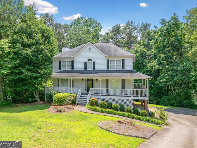 308 Golden Ct, Canton, GA 30114 - view of front of house with a porch, a front lawn, asphalt driveway, and a chimney