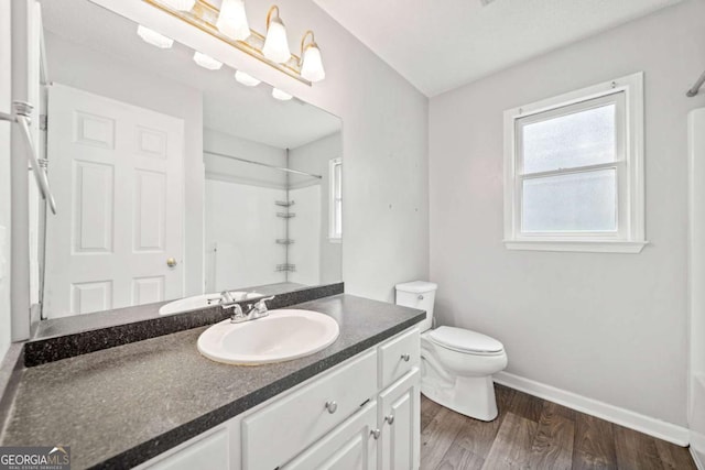 308 Golden Ct, Canton, GA 30114 - bathroom with vanity, toilet, wood finished floors, and baseboards