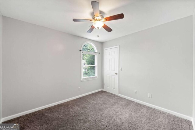 308 Golden Ct, Canton, GA 30114 - unfurnished room with baseboards, carpet floors, and a ceiling fan