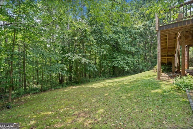 308 Golden Ct, Canton, GA 30114 - view of grassy yard featuring a view of trees and a wooden deck