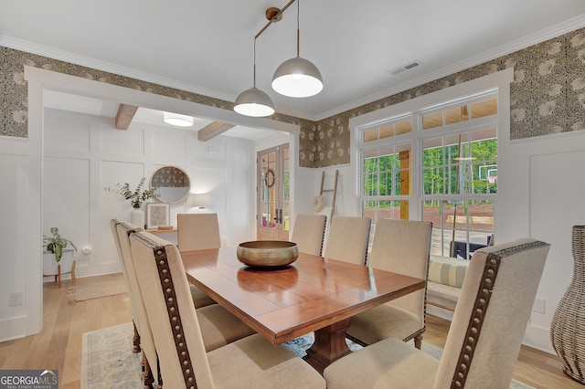 140 S Alexander Creek Rd, Newnan, GA 30263 - dining room with a decorative wall, wallpapered walls, light wood finished floors, and crown molding