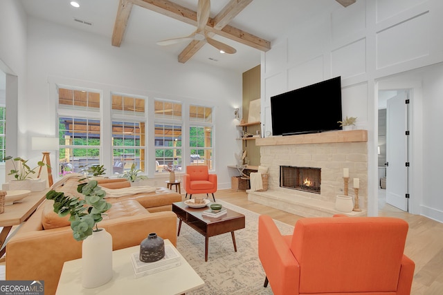 140 S Alexander Creek Rd, Newnan, GA 30263 - living area featuring ceiling fan, light wood-style floors, a fireplace, beamed ceiling, and recessed lighting
