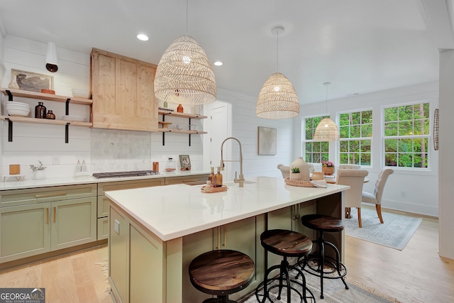 140 S Alexander Creek Rd, Newnan, GA 30263 - kitchen with open shelves, a sink, light wood-type flooring, stainless steel gas cooktop, and light countertops
