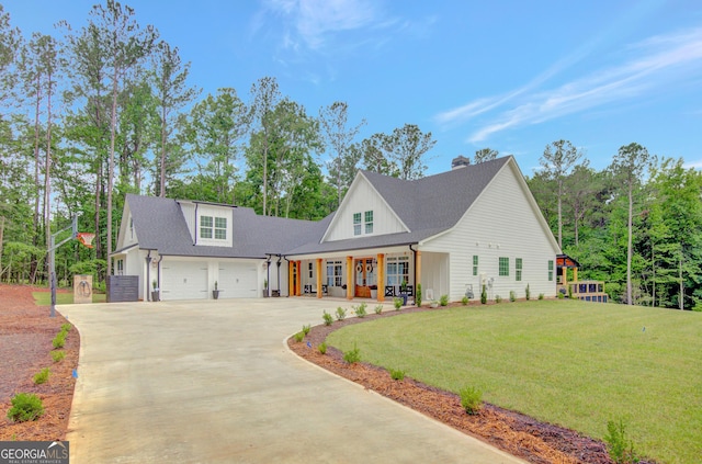 140 S Alexander Creek Rd, Newnan, GA 30263 - modern farmhouse style home with driveway, a front yard, a porch, a garage, and a chimney