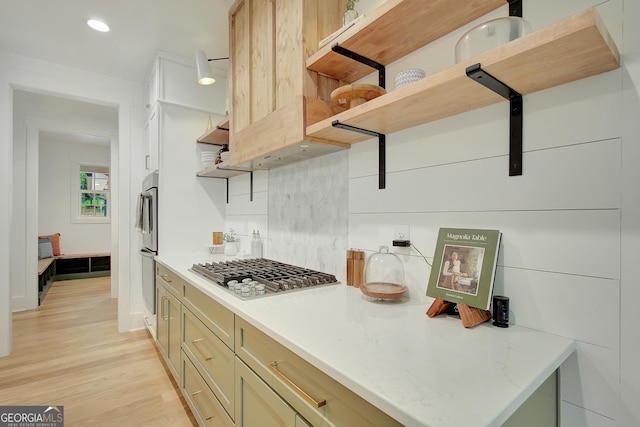 140 S Alexander Creek Rd, Newnan, GA 30263 - kitchen with open shelves, stainless steel appliances, light wood-style floors, decorative backsplash, and recessed lighting