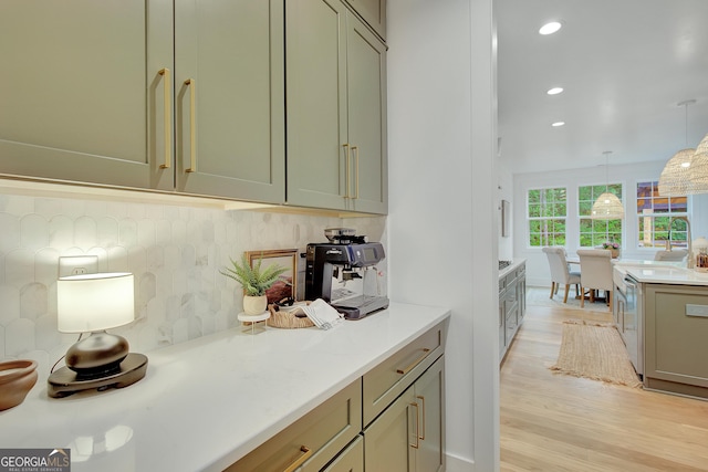 140 S Alexander Creek Rd, Newnan, GA 30263 - kitchen with backsplash, light wood finished floors, light countertops, recessed lighting, and pendant lighting
