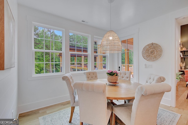 140 S Alexander Creek Rd, Newnan, GA 30263 - dining room featuring healthy amount of natural light, baseboards, and light wood finished floors