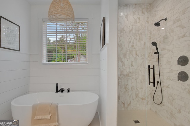 140 S Alexander Creek Rd, Newnan, GA 30263 - full bath with a stall shower, a soaking tub, and a wainscoted wall