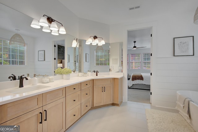 140 S Alexander Creek Rd, Newnan, GA 30263 - ensuite bathroom featuring double vanity, a bathtub, ceiling fan, and tile patterned flooring
