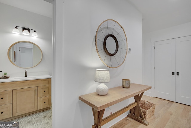 140 S Alexander Creek Rd, Newnan, GA 30263 - hall with a sink, light wood-type flooring, and baseboards