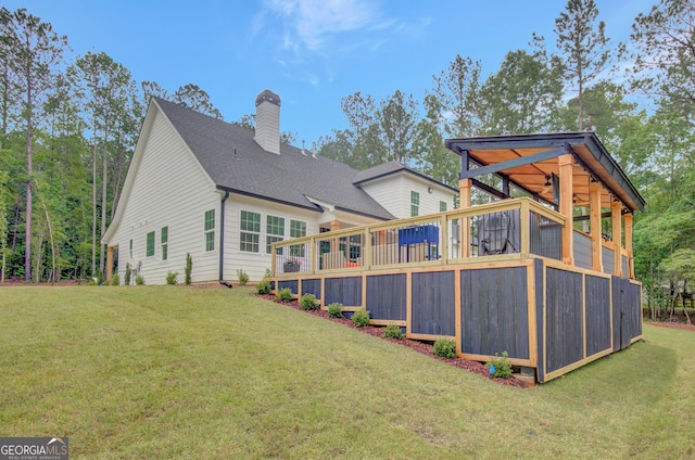 140 S Alexander Creek Rd, Newnan, GA 30263 - back of property with a chimney, a lawn, a deck, and a shingled roof