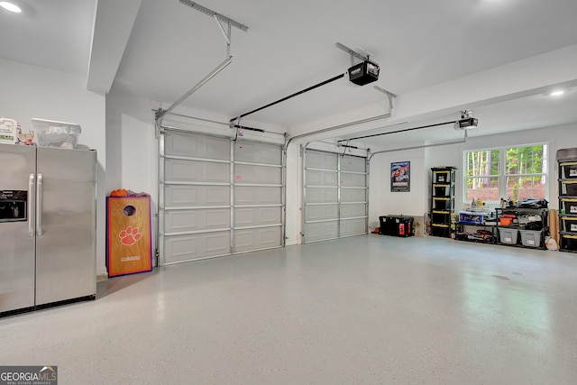 140 S Alexander Creek Rd, Newnan, GA 30263 - garage featuring stainless steel fridge, a garage door opener, and recessed lighting