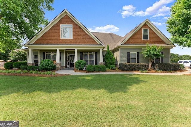 25 Wicklow Ct, Hoschton, GA 30548 - craftsman house featuring a front lawn and a porch