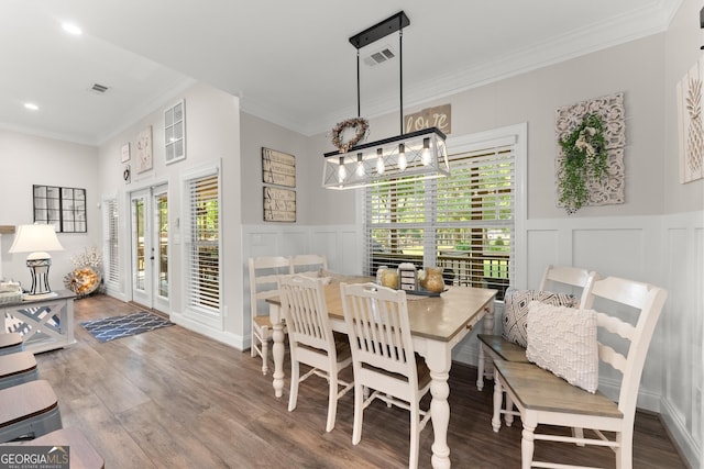 25 Wicklow Ct, Hoschton, GA 30548 - dining space with a decorative wall, ornamental molding, wood finished floors, wainscoting, and recessed lighting