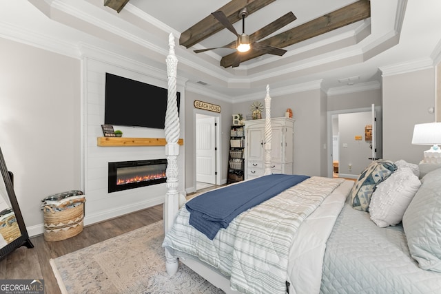 25 Wicklow Ct, Hoschton, GA 30548 - bedroom with a fireplace, a tray ceiling, wood finished floors, ornamental molding, and a ceiling fan