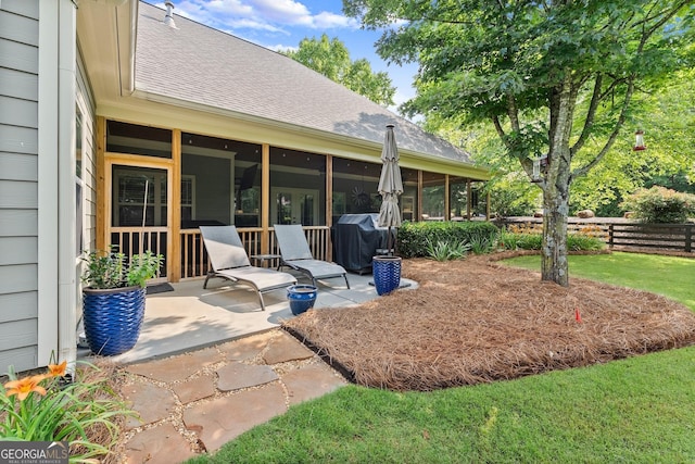 25 Wicklow Ct, Hoschton, GA 30548 - view of yard featuring a sunroom and a patio area