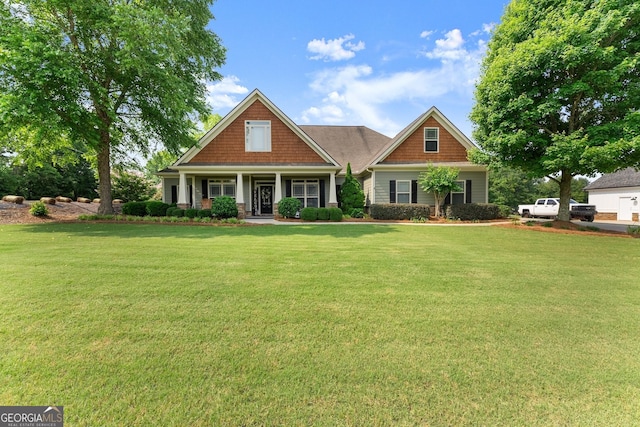 25 Wicklow Ct, Hoschton, GA 30548 - craftsman house featuring a front lawn and a porch