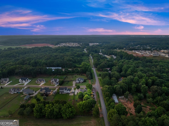 25 Wicklow Ct, Hoschton, GA 30548 - aerial view of property and surrounding area with a heavily wooded area