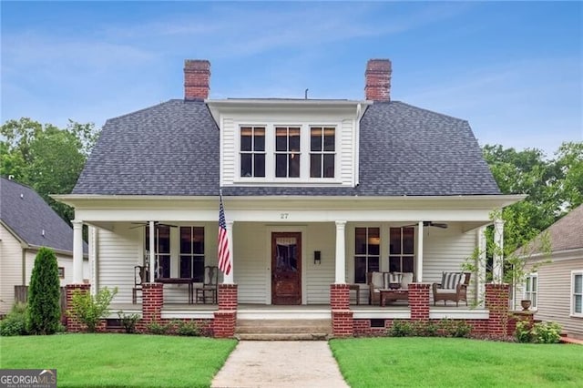 27 Sessions St NW, Marietta, GA 30060 - bungalow-style home with ceiling fan, a front lawn, covered porch, and a chimney