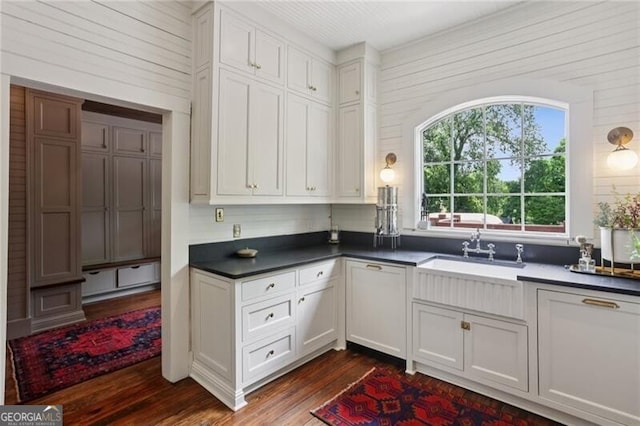 27 Sessions St NW, Marietta, GA 30060 - kitchen featuring dark wood finished floors, healthy amount of natural light, dark countertops, and wood walls