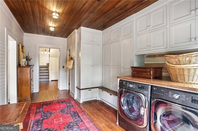 27 Sessions St NW, Marietta, GA 30060 - laundry area featuring wood finished floors, washing machine and clothes dryer, wood ceiling, and cabinet space