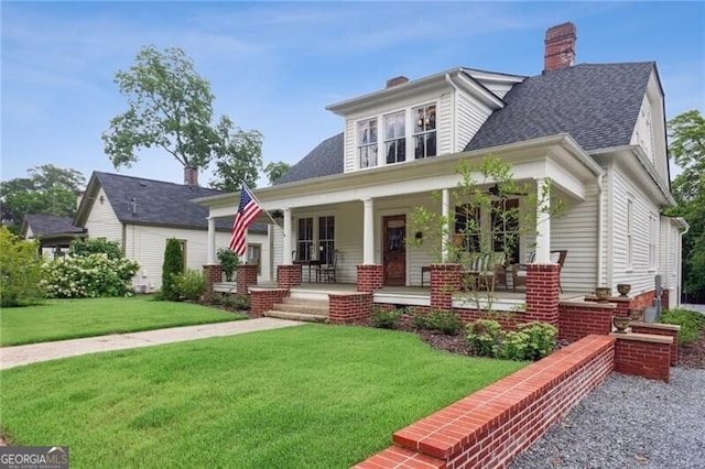 27 Sessions St NW, Marietta, GA 30060 - view of front facade featuring covered porch, a front lawn, a chimney, and a shingled roof