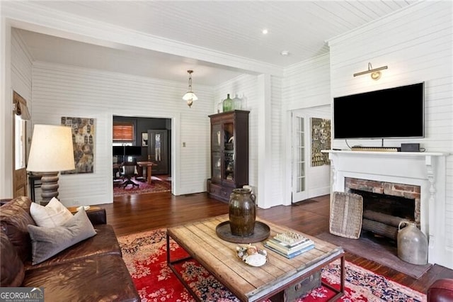 27 Sessions St NW, Marietta, GA 30060 - living area featuring wood finished floors, crown molding, and a fireplace