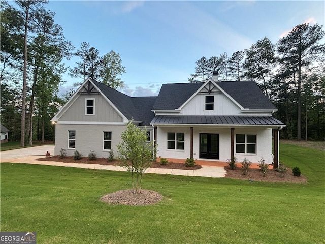5680 Mack Way, Gainesville, GA 30506 - modern inspired farmhouse featuring covered porch, a standing seam roof, a front yard, and a metal roof