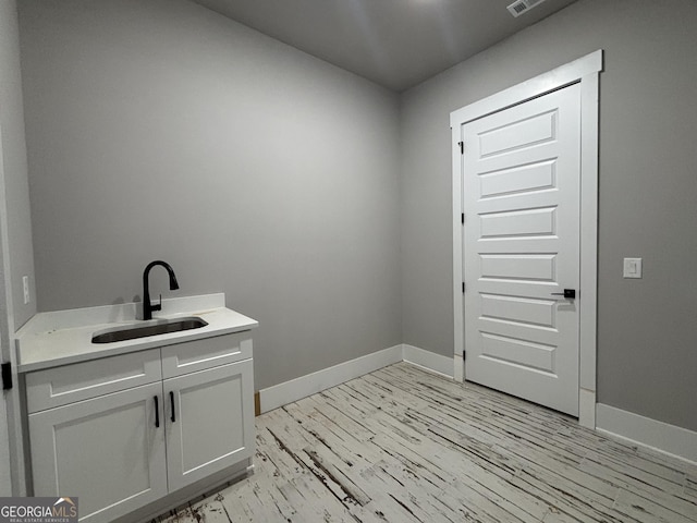 5680 Mack Way, Gainesville, GA 30506 - washroom with a sink and light wood-style floors
