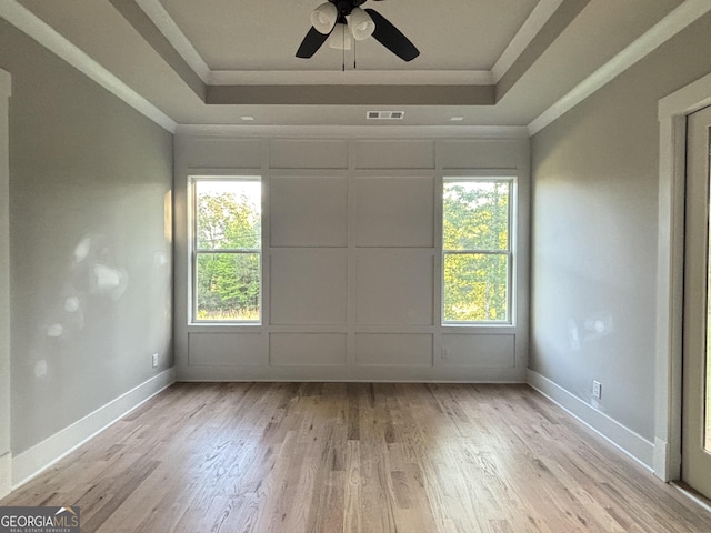 5680 Mack Way, Gainesville, GA 30506 - spare room with a tray ceiling, crown molding, wood finished floors, a ceiling fan, and a decorative wall