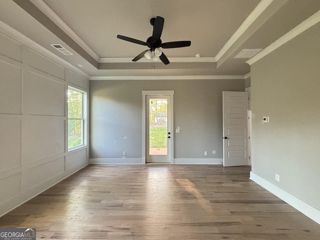 5680 Mack Way, Gainesville, GA 30506 - spare room featuring a tray ceiling, crown molding, wood finished floors, and ceiling fan