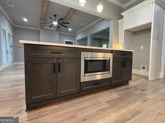 5680 Mack Way, Gainesville, GA 30506 - kitchen with stainless steel microwave, ceiling fan, white cabinetry, light wood finished floors, and crown molding