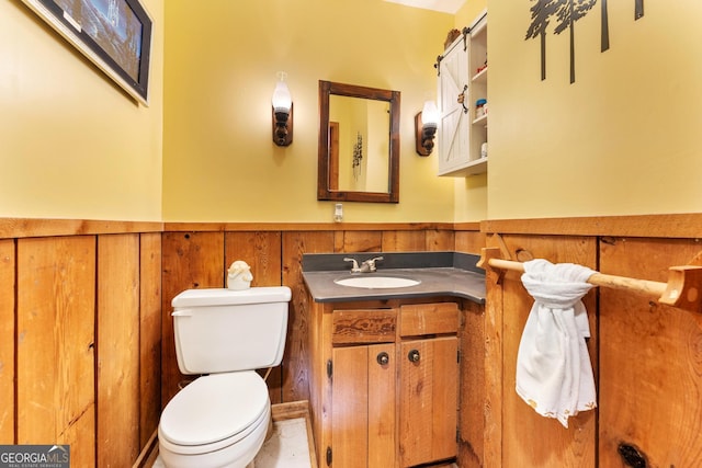 367 Woodbrier, Sautee Nacoochee, GA 30571 - half bathroom with a wainscoted wall, vanity, and toilet