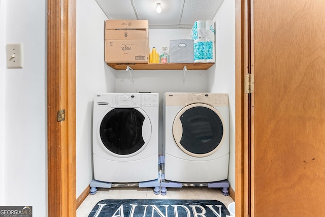 367 Woodbrier, Sautee Nacoochee, GA 30571 - laundry area featuring washer and dryer, tile patterned floors, and baseboards