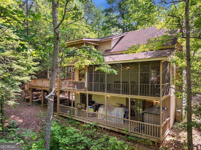 367 Woodbrier, Sautee Nacoochee, GA 30571 - back of property featuring a sunroom, roof with shingles, and a deck