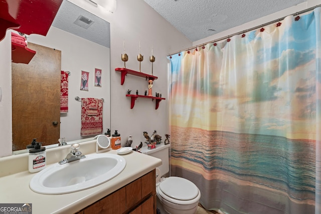 5512 Goodwick Way, Norcross, GA 30071 - bathroom featuring a textured ceiling, vanity, and toilet