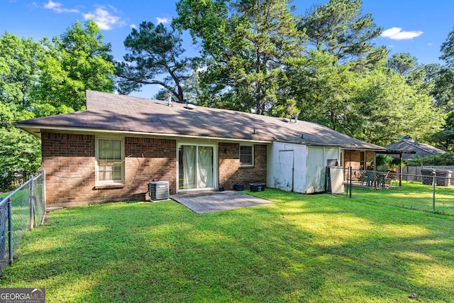 5512 Goodwick Way, Norcross, GA 30071 - rear view of house featuring brick siding, central AC, a patio area, and a shingled roof