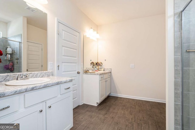 113 Waterside Dr, Calhoun, GA 30701 - full bath with vanity, wood finished floors, a tile shower, and baseboards
