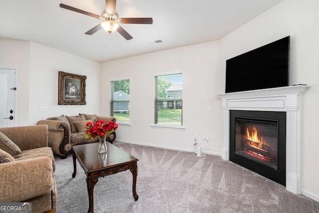 113 Waterside Dr, Calhoun, GA 30701 - carpeted living area featuring a glass covered fireplace, a ceiling fan, and baseboards