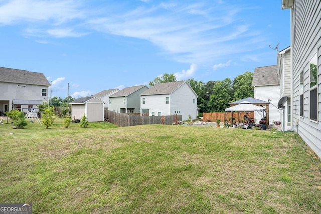 113 Waterside Dr, Calhoun, GA 30701 - view of yard featuring a gazebo, a storage unit, and a residential view